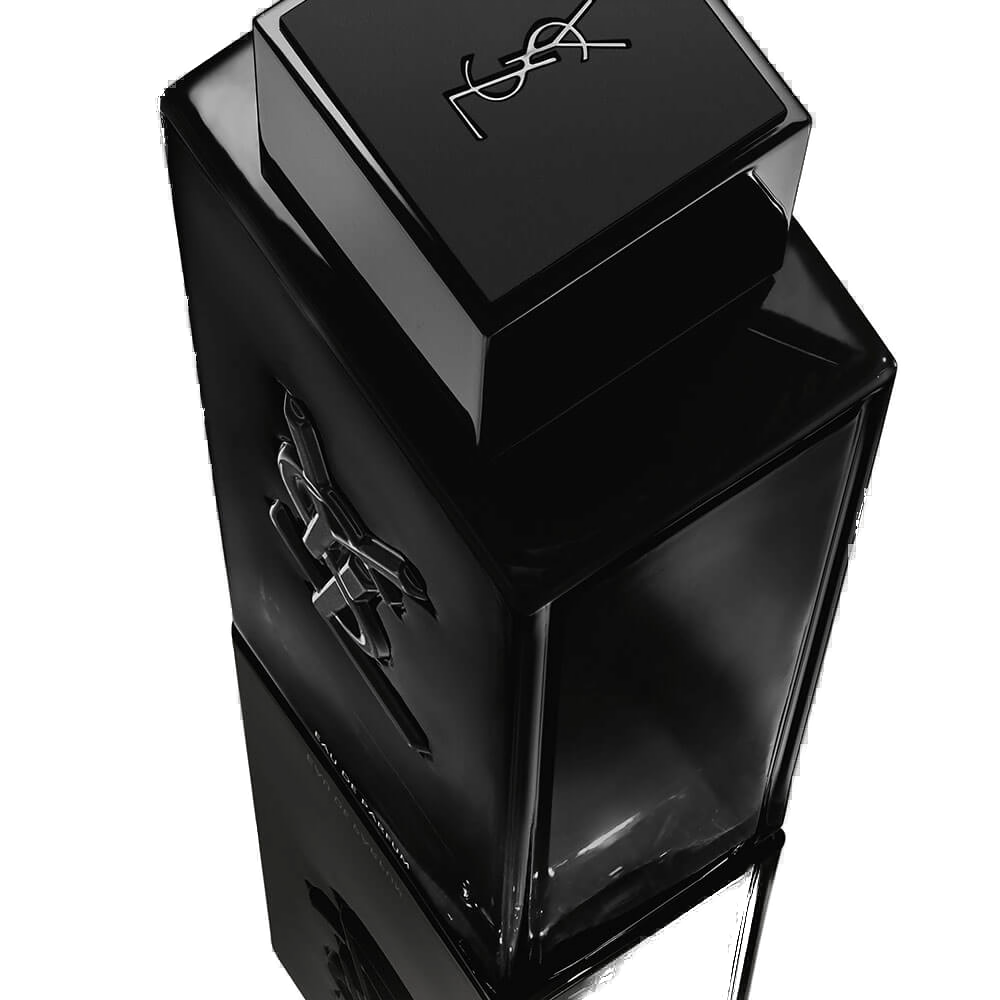 Detalhe do frasco MYSFL: monograma YSL escavado em relevo profundo no vidro preto, tampa magnética escovada.